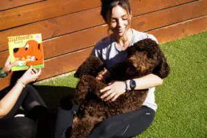 woman holding dog